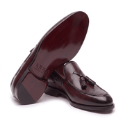 Close-up of burgundy leather tassel loafer sole and heel