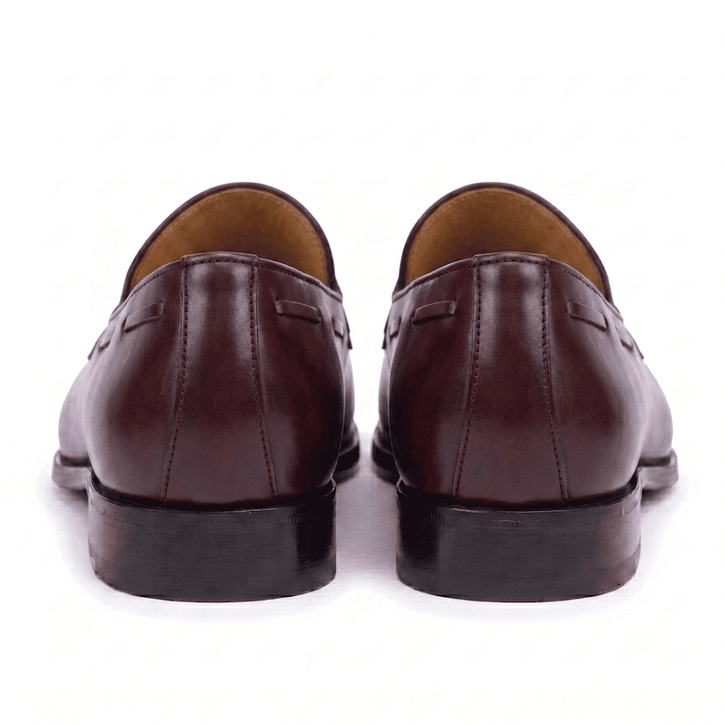 Back view of mens burgundy leather tassel loafers showing sole