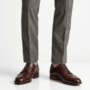 Men wearing Burgundy Wingtip Brogue Derby shoes with formal trousers