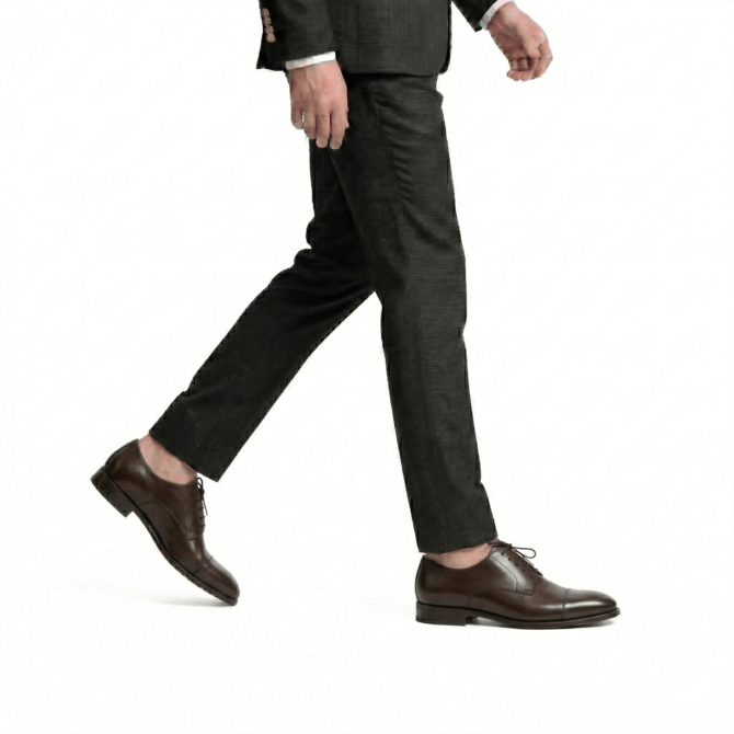 Side wear view of dark brown cap toe Oxford shoes for men

