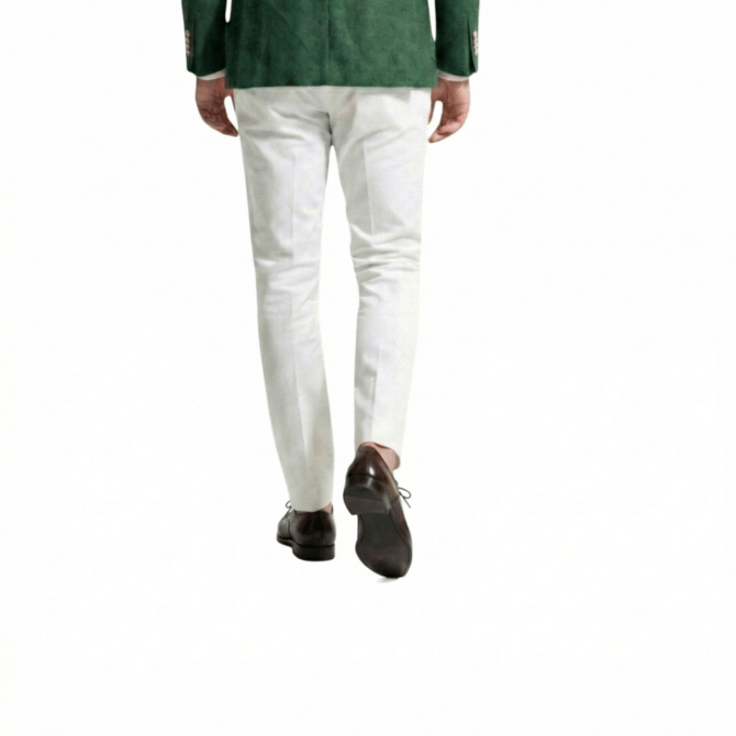 Dark brown oxford shoes styled with white trousers back walking view