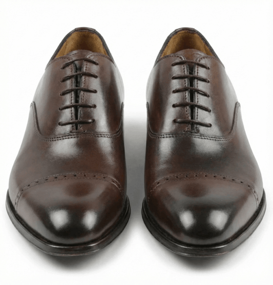 Top view of dark brown leather oxford shoes classic closed lacing