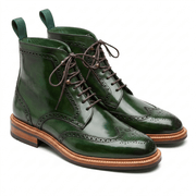 A pair of handcrafted forest green leather wingtip brogue boots with dark brown laces and a natural wood-tone welted sole.