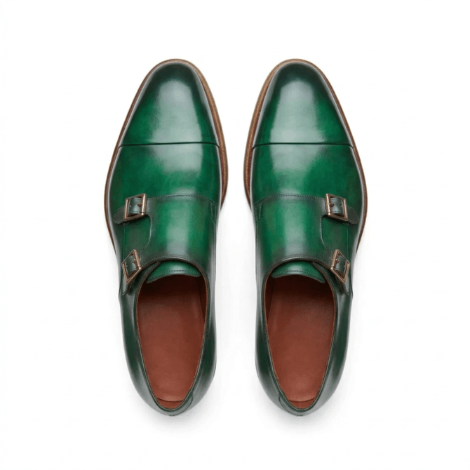 Top view of green double monk strap formal shoes with sleek almond toe design