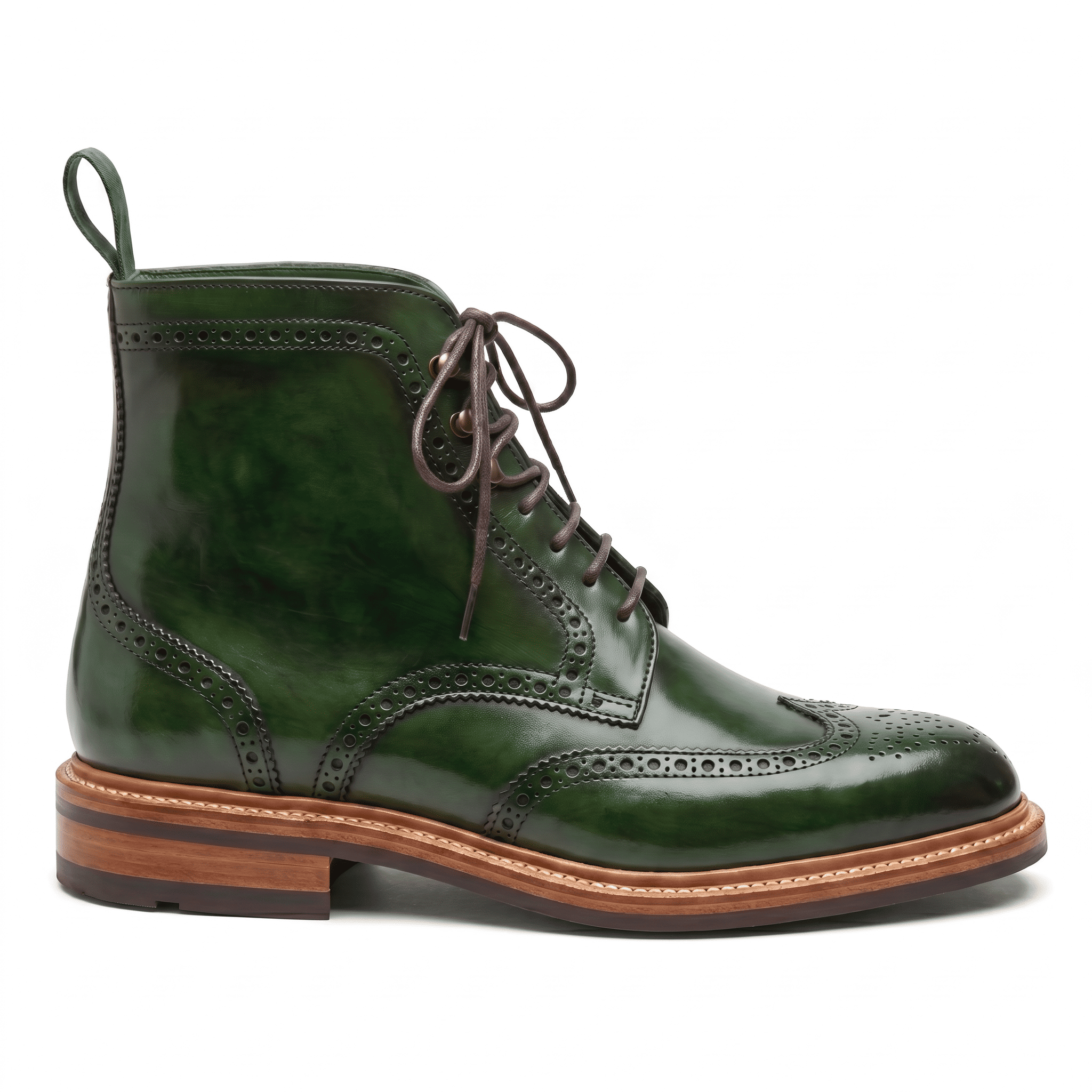 A clean side profile of the forest green wingtip boot showcasing the ankle height and classic welted sole.