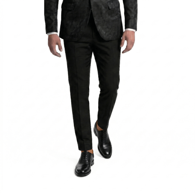 Men's luxury black leather oxford shoes with traditional broguing, captured from a front-facing action perspective.