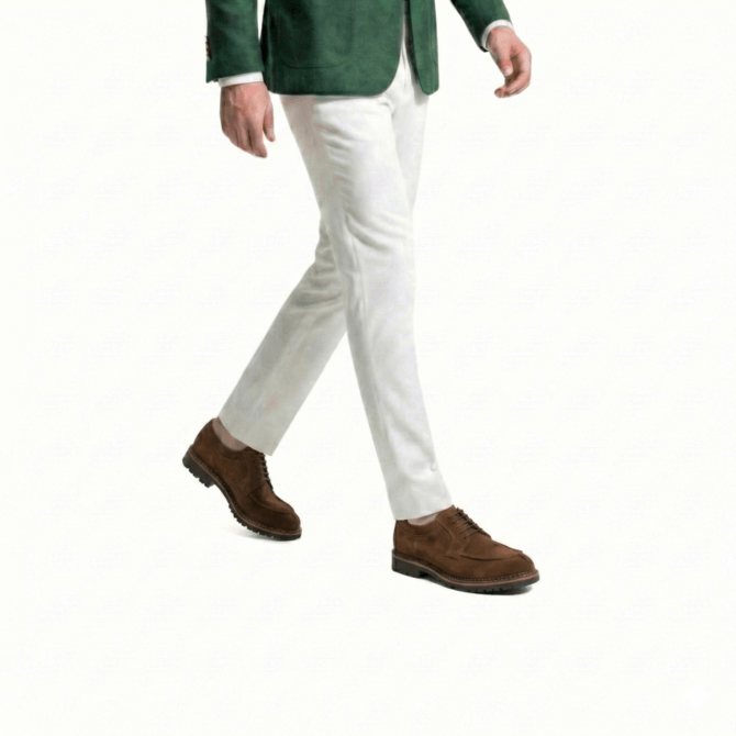 Side walking view of men wearing brown suede derby shoes