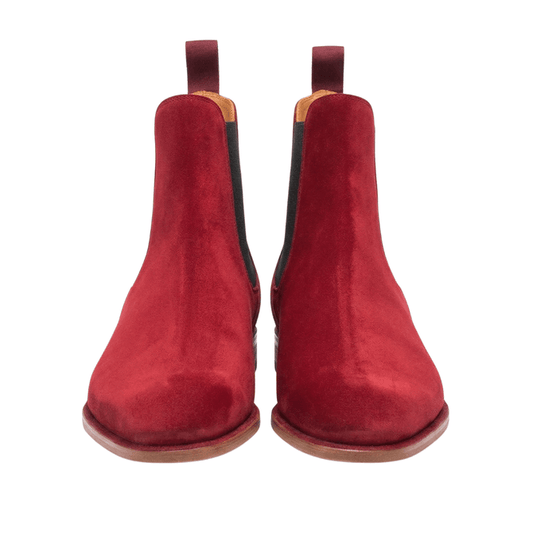 Front-facing view of a pair of premium men's Chelsea boots in rich burgundy suede, showcasing the elegant almond-toe shape and symmetrical handcrafted design on a clean white background.