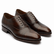 Brown leather Oxford shoes for men in three-quarter view
