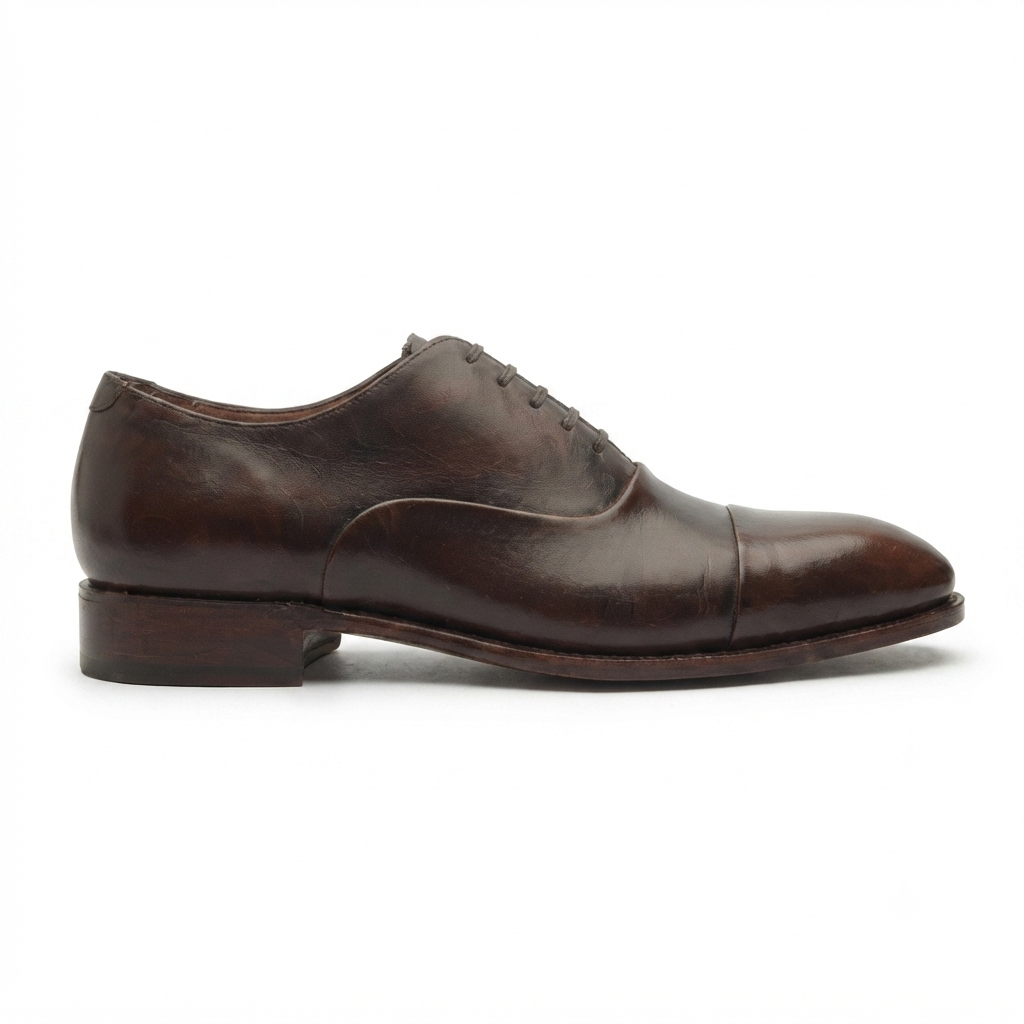 Brown leather Oxford shoes for men in side profile