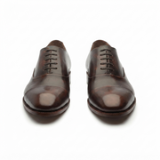 Brown leather Oxford shoes for men shown from the front