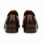 Brown leather Oxford shoes for men showing the back heel