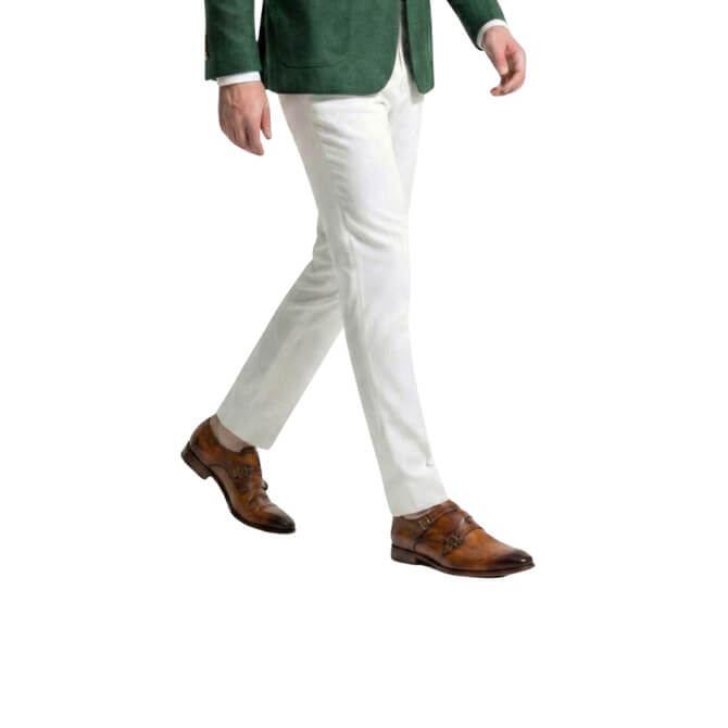 Profile walking shot of handcrafted tan leather double monk strap shoes for men, styled for a sophisticated smart-casual look.