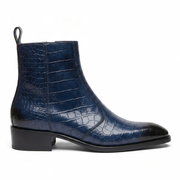 A profile view of a luxury men's navy blue crocodile embossed leather boot featuring a burnished black toe and side zip closure on a white background.