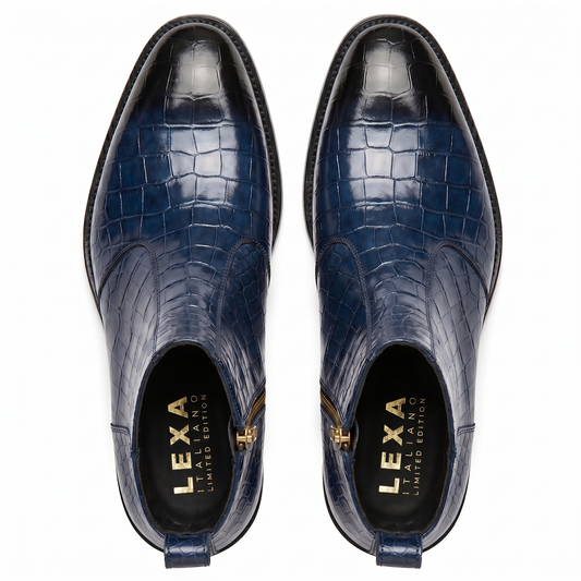 Top-down view of men's navy blue croc-patterned boots showing the gold branded insoles and tapered toe shape.