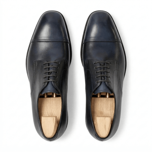 Top view of navy blue leather Oxford shoes for men