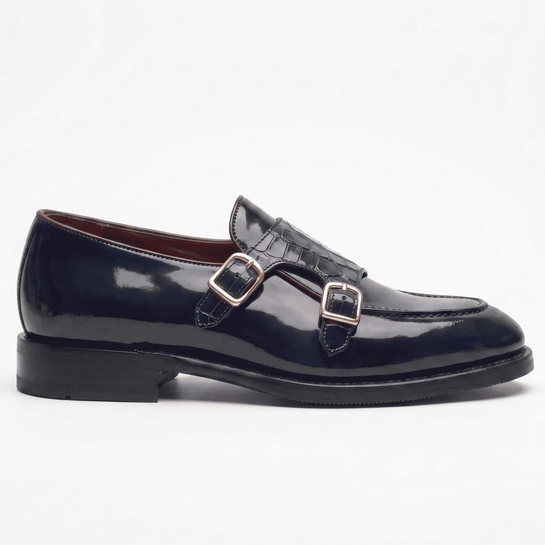 Side profile of mens navy blue double monk strap shoe with buckle detailing