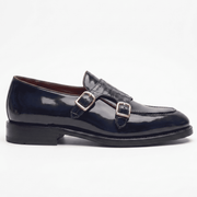 Side profile of mens navy blue double monk strap shoe with buckle detailing