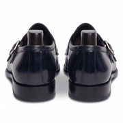 Back view of navy blue double monk strap shoes showing heel and sole