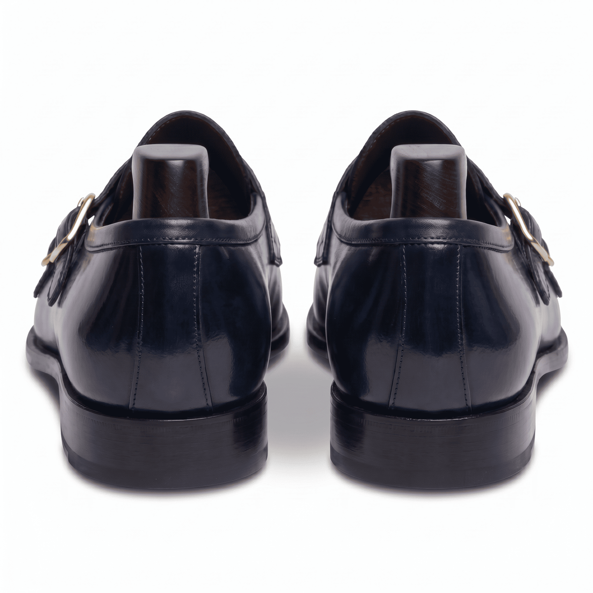 Back view of navy blue double monk strap shoes showing heel and sole
