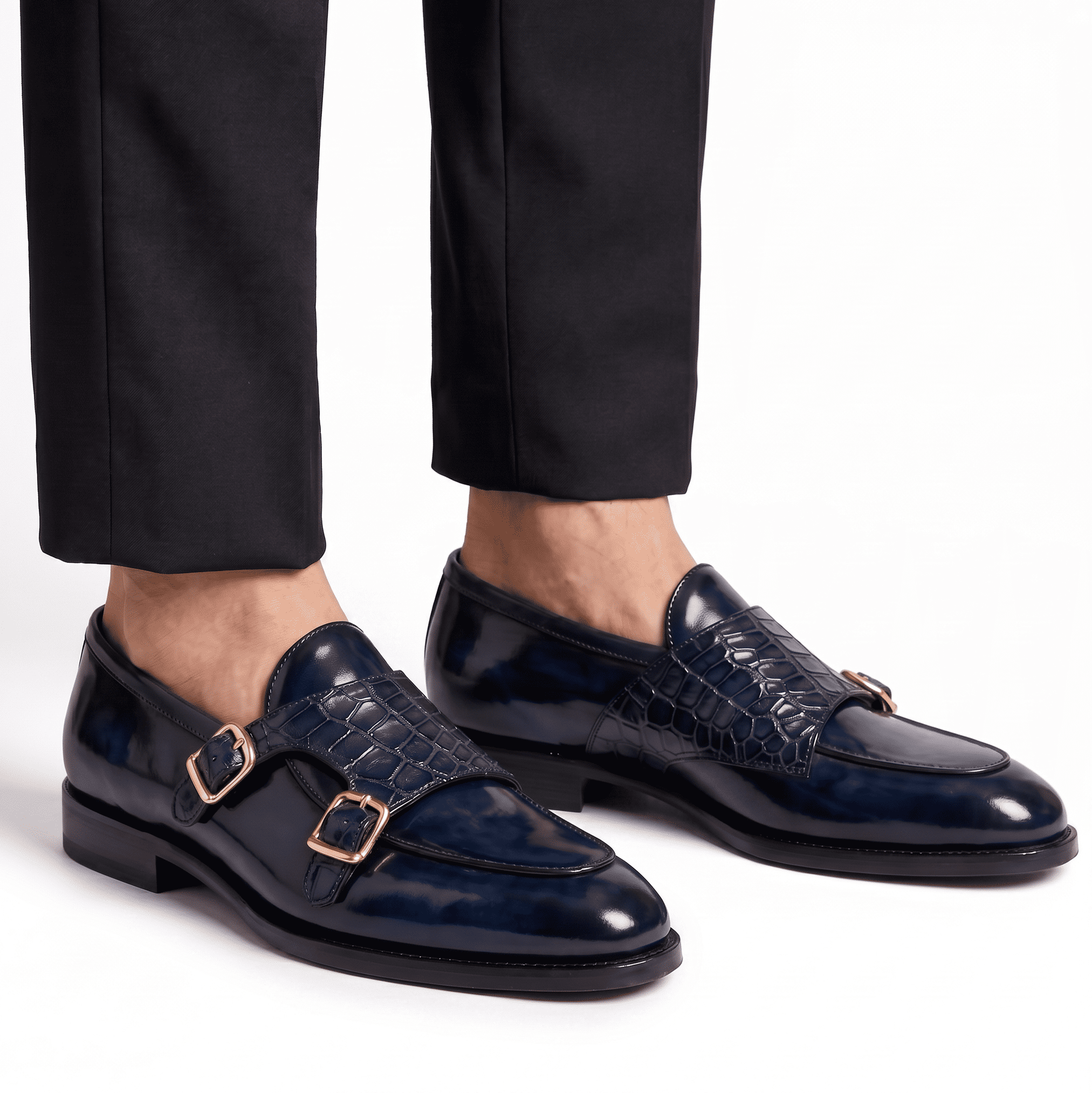 Man wearing navy blue double monk strap shoes with black trousers