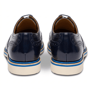 Back view of the shoes focusing on the layered sole construction and the polished navy leather heel.