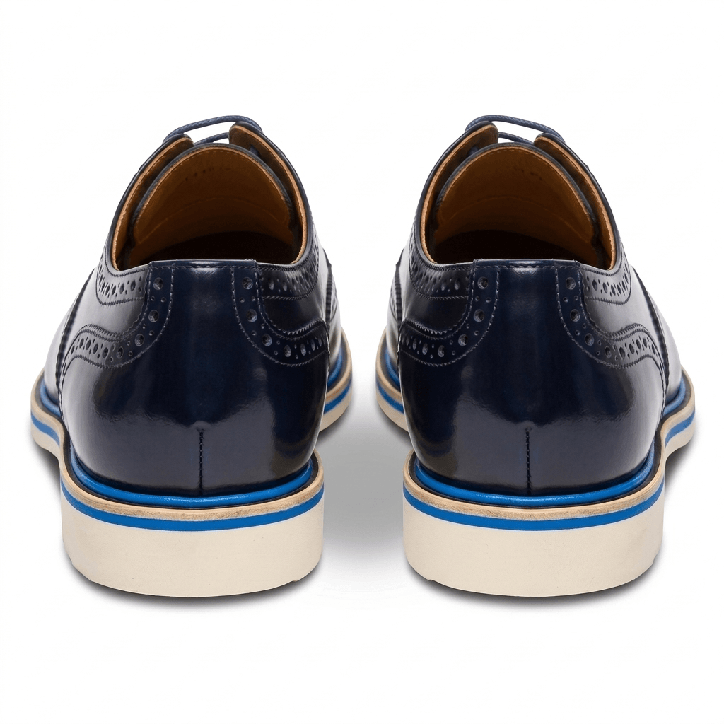 Back view of the shoes focusing on the layered sole construction and the polished navy leather heel.