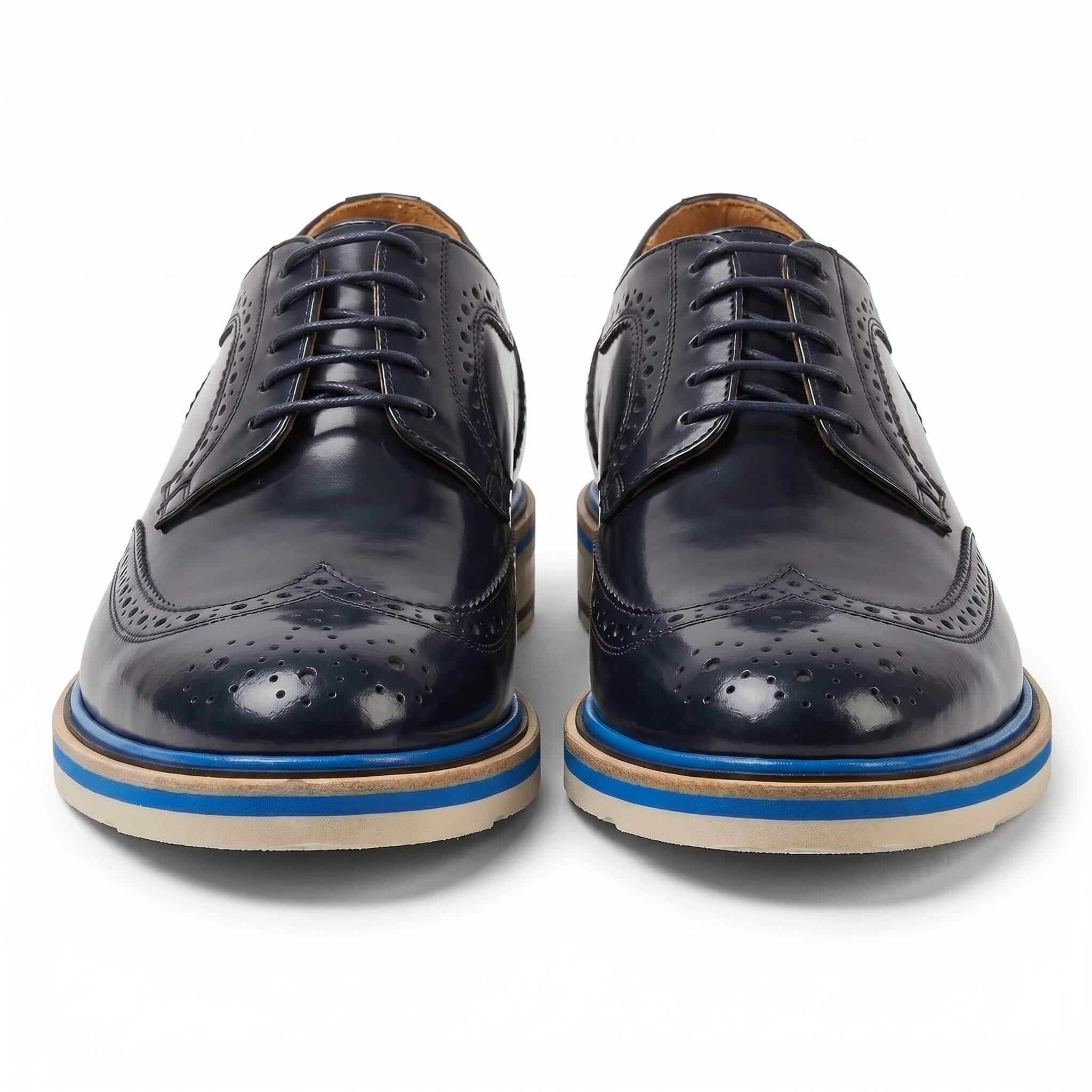 Front-facing pair of navy blue dress shoes highlighting the round toe and traditional derby lacing system.