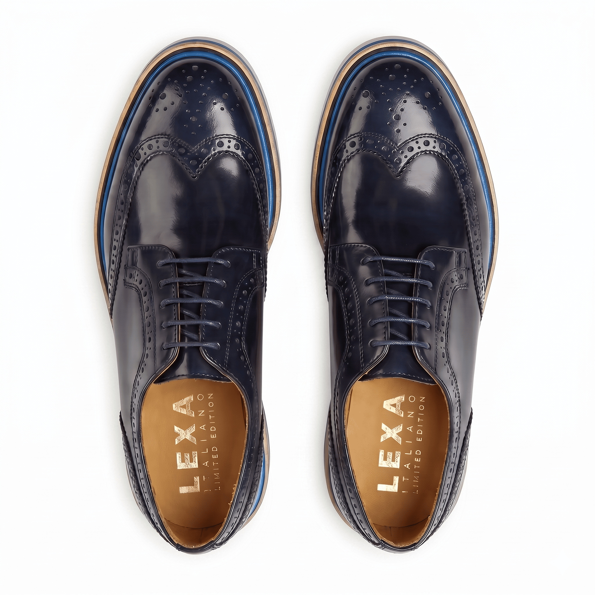 Birds-eye view of navy leather brogues showing the symmetrical wingtip design and gold-branded tan leather insoles.