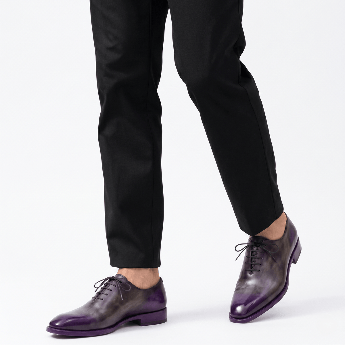 Men wearing purple patina Oxford leather shoes with black trousers