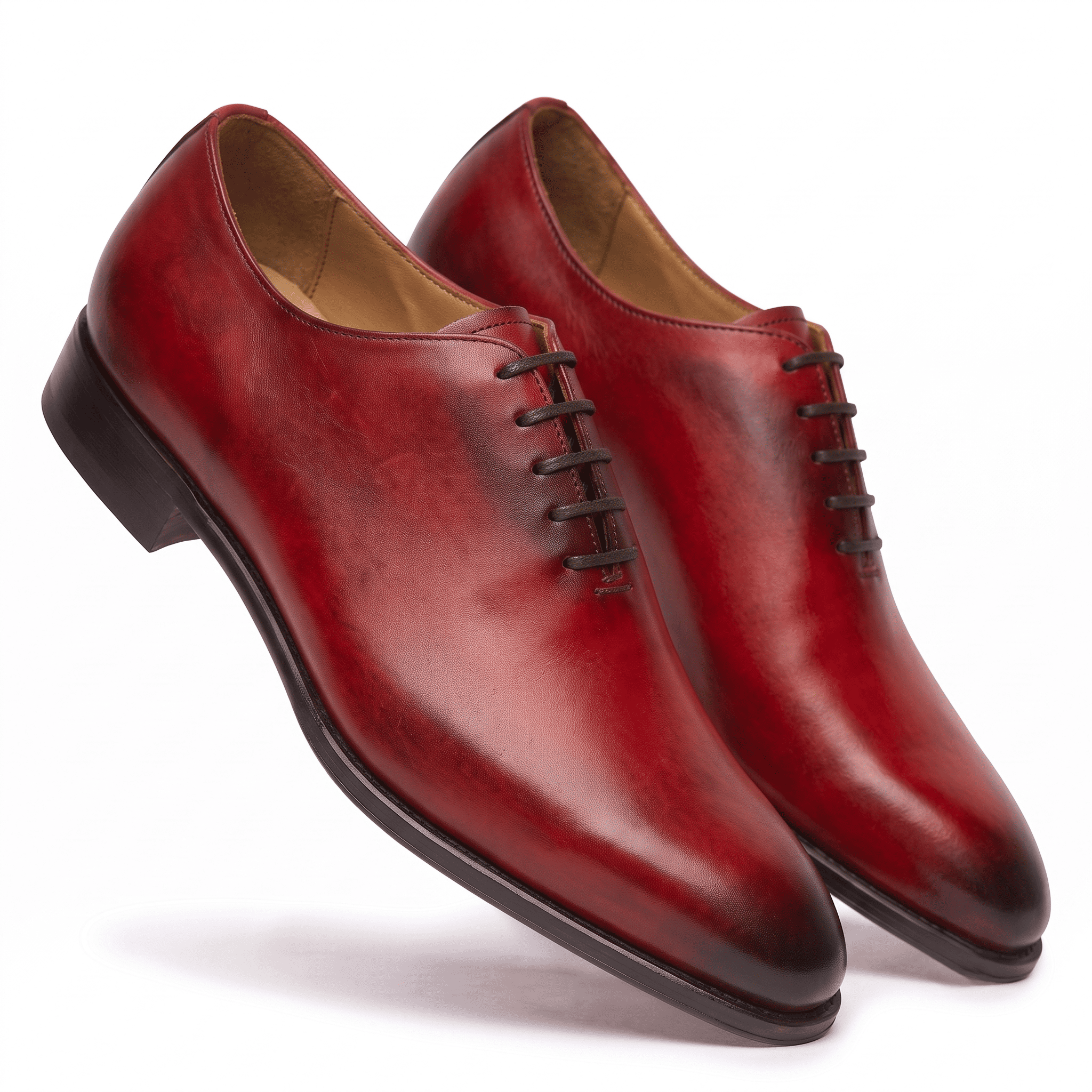 Angled view of premium red hand-painted cap-toe Oxford shoes for men showcasing elegant craftsmanship