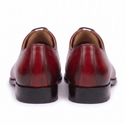 Back view of handcrafted red genuine leather Oxford shoes for men highlighting the heel and premium finish.
