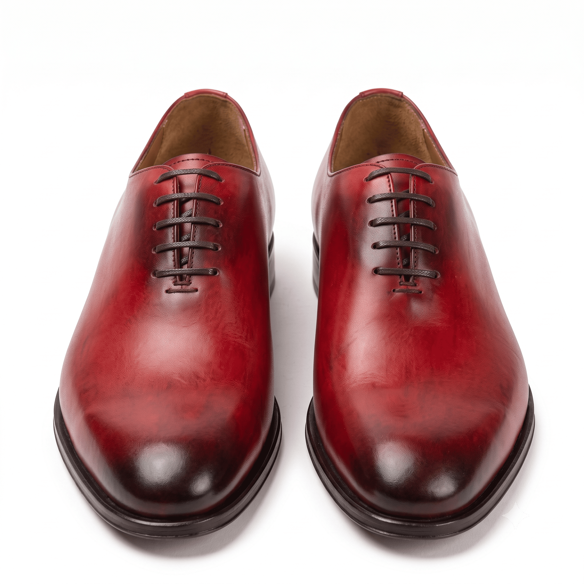 Front view of red leather cap-toe Oxford shoes for men featuring a polished toe and classic lace-up design.
