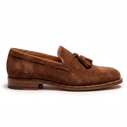 Side silhouette of tan suede tassel loafers for men