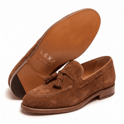 Sole view of tan suede tassel loafers for men