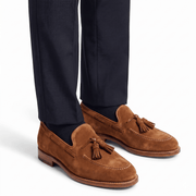 Men wearing tan suede tassel loafers with formal trousers