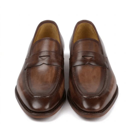 Top view of brown patina leather loafers for men